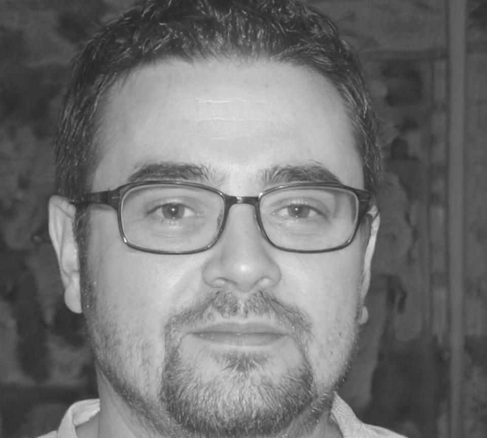 Professional headshot of Andrej Kovalenko, Lead Database Architect